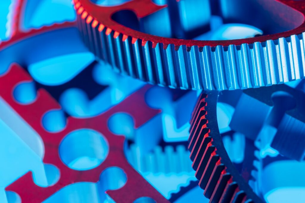 Macro shot of colorful interlocking gears demonstrating precision engineering and industrial design.